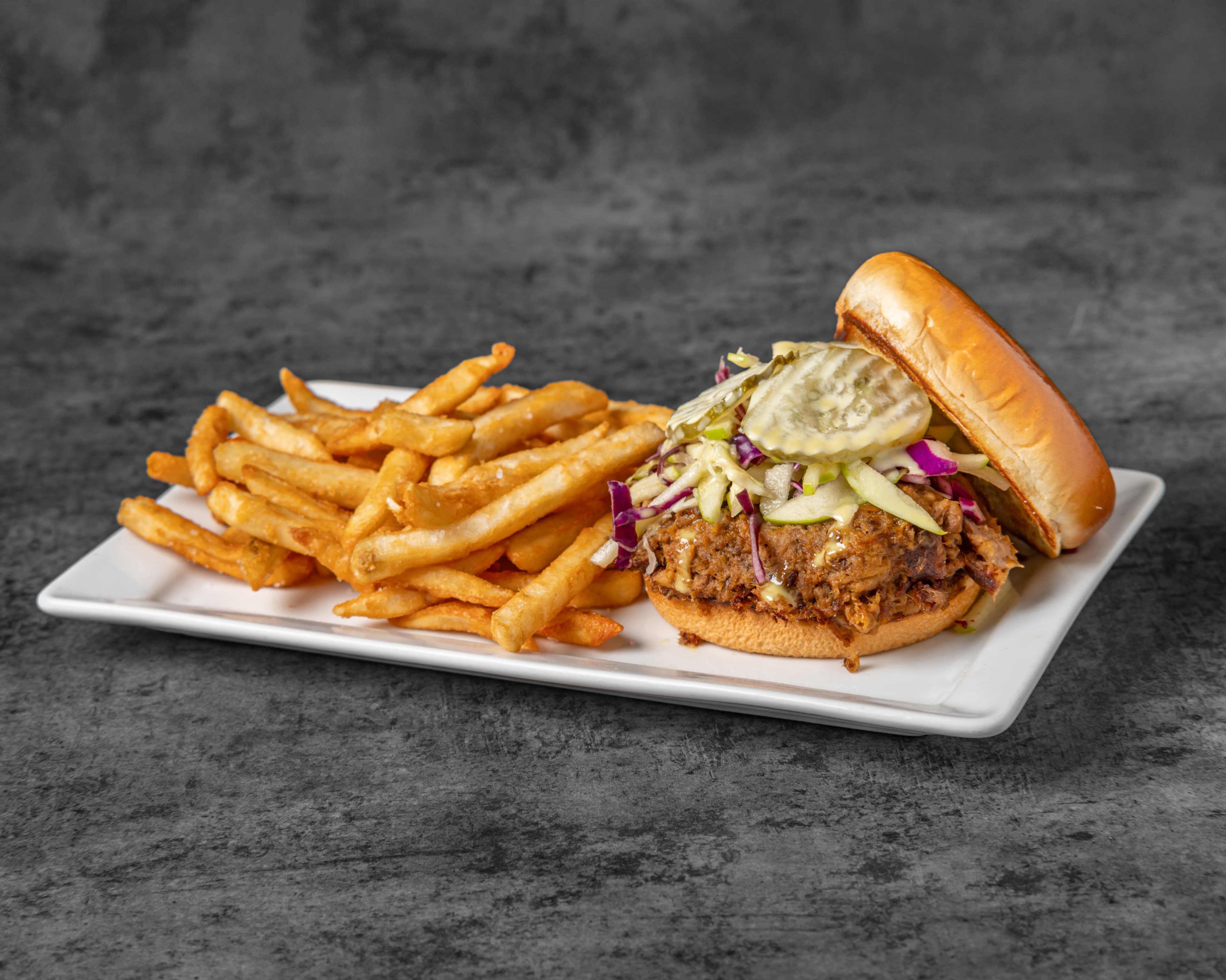 Pulled Pork Sandwich - Slow-cooked BBQ pork, coleslaw at QuartHaus Chandler